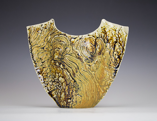Ceramic vase by Riley McManus with the impressions of stromatolites from the petrified sea gardens at Saratoga Springs, NY.