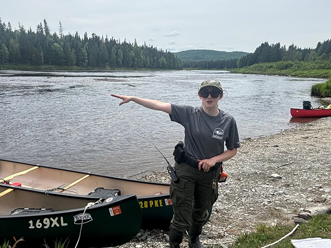 Allagash Wilderness Waterway Ranger Alissa Lutz greeting paddlers at Michaud Farm.