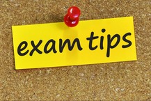 Image of a note marked "exam tips," thumbtacked to a corkboard