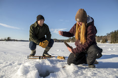 people ice fishing