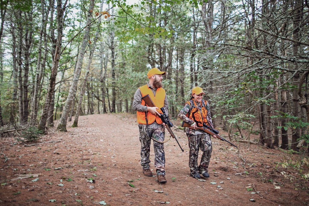 deer hunters walking through woods