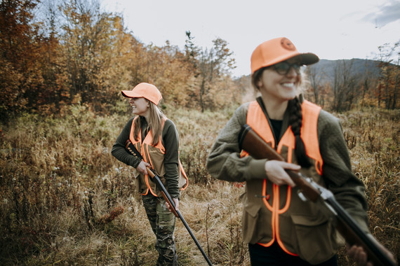 two bird hunters in field