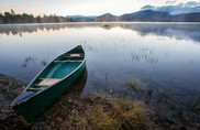 canoe on serene pond