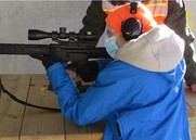 woman firing an AR 