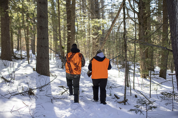 two people hunting in winter