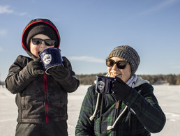 mother and son drinking hot chocolate