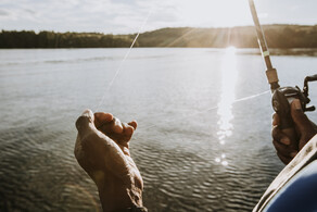 man holding fishing rod