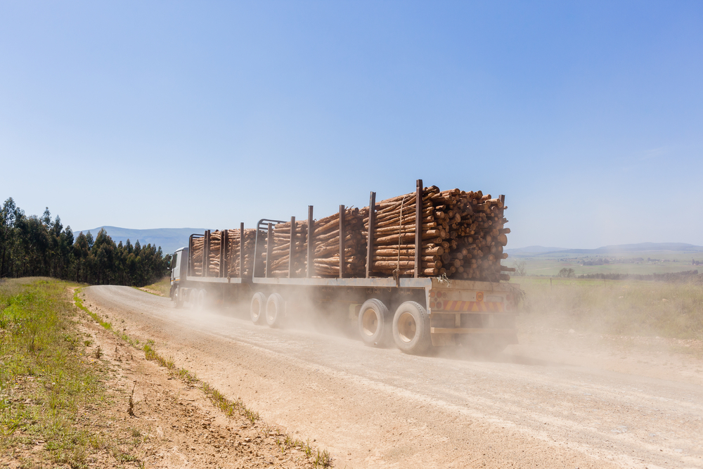 Logging truck traveling on dusty roads