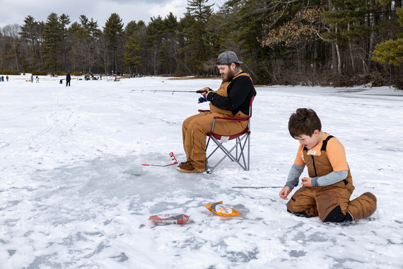 Father and son jigging for fish