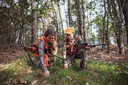 Hunters examining sign