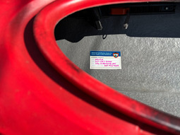 If Found Sticker in a red kayak