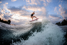 woman wake surfing behind a boat