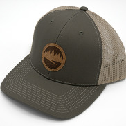 A hat with a leather Outdoor Partners logo on the front.