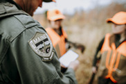hunter having license checked by Maine Game Warden