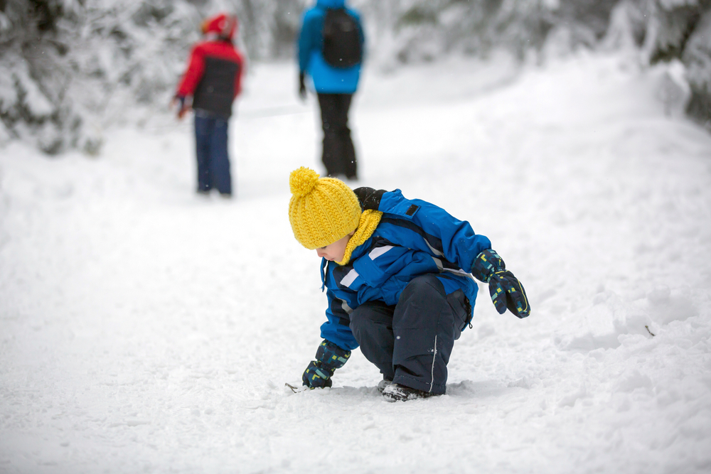 A kid exploring in snow