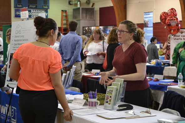 A job seeker and an employer meet at the York County Career Fair in 2016