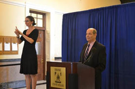 Pictured right to left: Richard Freund, Deputy Commissioner of the Maine Department of Labor & Regan Thibodeau, interpreter