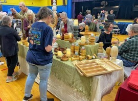 This is a picture of People visiting exhibit tables