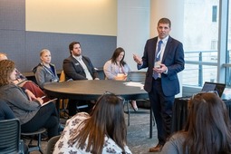 Director Boring speaking at roundtable in Grand Rapids