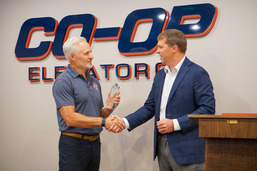 Director Boring presents Cooperative Elevator Co. with the Agriculture Exporter of the Year Award