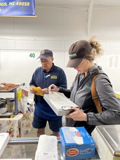 Photograph of an MDARD inspector meeting a business owner during a food safety inspection