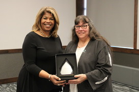 Roberson presenting Gasco-Bentley with a service award