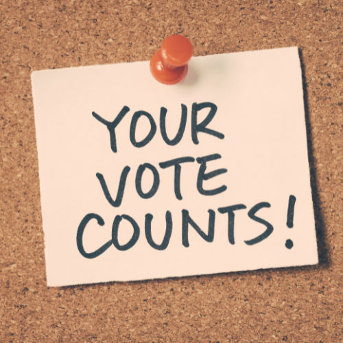 Your vote counts sticker on corkboard