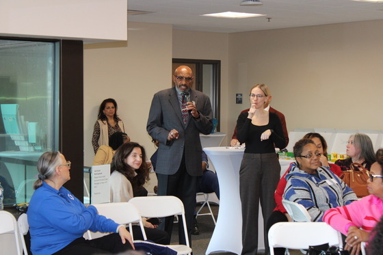 Director Johnson addresses the crowd attending the Flint Open House on October 28th.