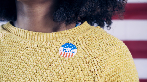 Person with I Voted sticker