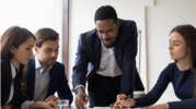 Coworkers working on a document in an office