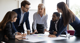 group of office workers having a meeting around a table