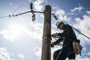 lineman climbing a pole