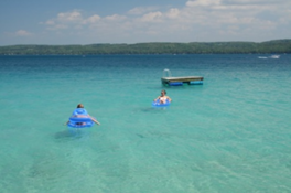 people floating in lake