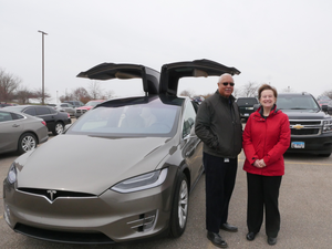 EGLE staffers Robert Jackson and Debbie Swartz at an electric vehicle ride and drive in Lansing in April 2019.