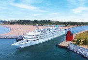 The Pearl Mist cruise ship enters Lake Michigan at Holland, Michigan. Photo courtesy of Cruise the Great Lakes.