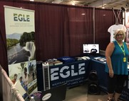 EGLE staffer Chrissie Pearce at EGLE exhibit at the Upper Peninsula State Fair in 2019. EGLE Classroom will visit the fair for the first time in 2022.