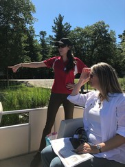 Katie Hager, of the Saginaw Chippewa Indian Tribe, explains the wild rice restoration project at Lake Tawas to EGLE Director Liesl Clark.