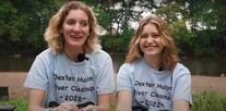 Dexter High School seniors Allie Kangas and Malia Yalisove organized volunteer cleanups of the Huron River with help from a MiCorps grant.