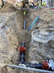 Drinking Water State Revolving Fund project showing workers upgrading underground water infrastructure. 