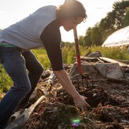 Luis Chen of Wormies turns compost with a pitchfork. (Courtesy of Wormies.)