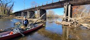 Michigan Waterways Stewards founder Mike Stout working on cleaning and clearing a Grand River river-wide obstruction in north Lansing. 