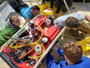 Students prepare for a remote-operated vehicle dive at Northwestern Michigan College. Photo courtesy of Great Lakes Water Studies Institute, NMC.