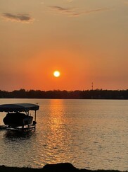 Sunset at Lake Lansing showing effect of smoky sky in May 2023. Courtesy of Cheri Riemer.