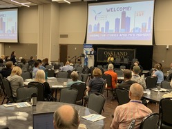 EGLE's Climate and Energy Advisor, Cory Connolly, and Environmental Justice Public Advocate, Regina Strong presenting at the 2023 MI Climate Summit