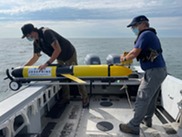 Researchers at the Cooperative Institute for Great Lakes Research (CIGLR) launch a GLOS autonomous underwater glider into Lake Erie. 