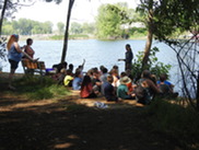 Children  learning about restoration of the Muskegon Lake Area of Concern. Courtesy of West Michigan Shoreline Regional Development Commission.