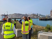 EGLE staff observing field response tactics for a simulated oil spill.