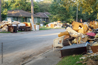 Storm debris from flooding placed at curb