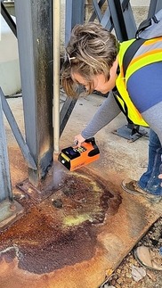 Air Quality Division staffer takes an air sample.