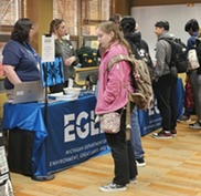 Students at an EGLE exhibit at the 2024 Student Summit at Michigan State University.